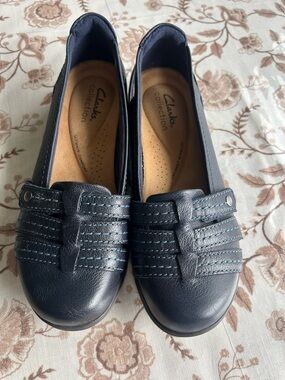 Clarks Navy Women's Slip-On Loafers with Decorative Strap Stitching